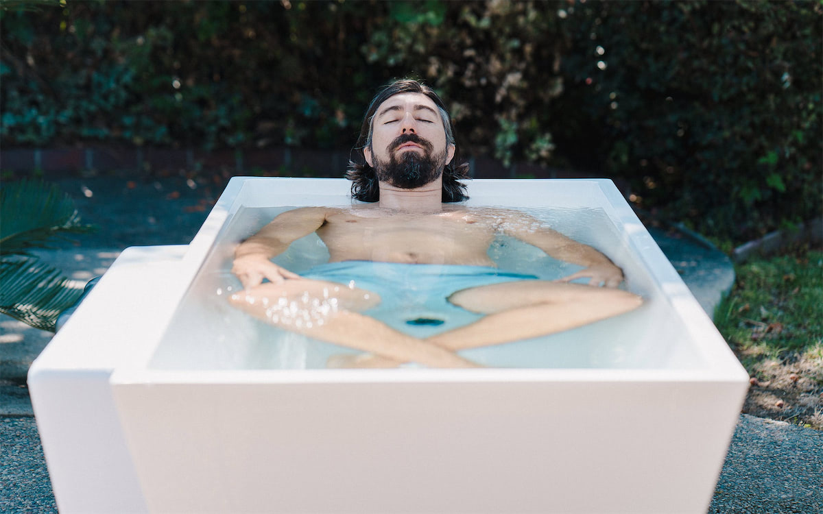 man relaxing in cold plunge tub