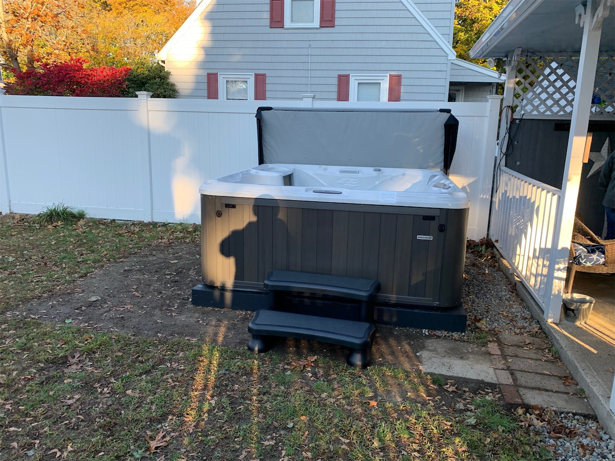 sundance hot tub installed next to the house