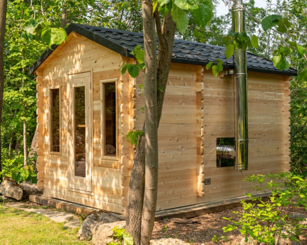 side view of Leisurecraft Georgian Cabin Sauna surrounded by trees