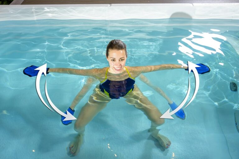 woman doing aqua fitness in hydropool swim spa|woman is swimming in hydropool swim spa|woman doing aqua aerobics in swim spa|woman is doing squats in hydropool swim spa|woman doing aqua-lunges in swim spa