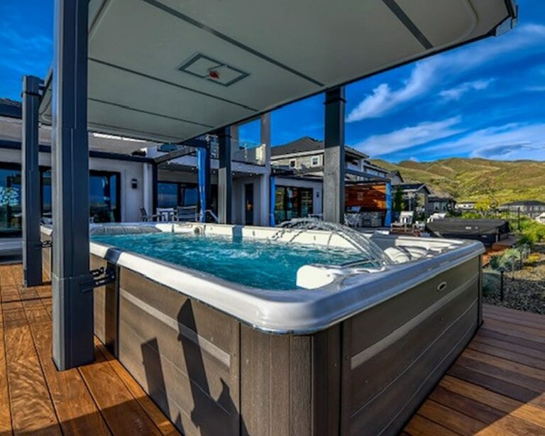 hydropool swim spa with gazebo closure photo|swim spa installed in a room|woman enjoying massage in a swim spa