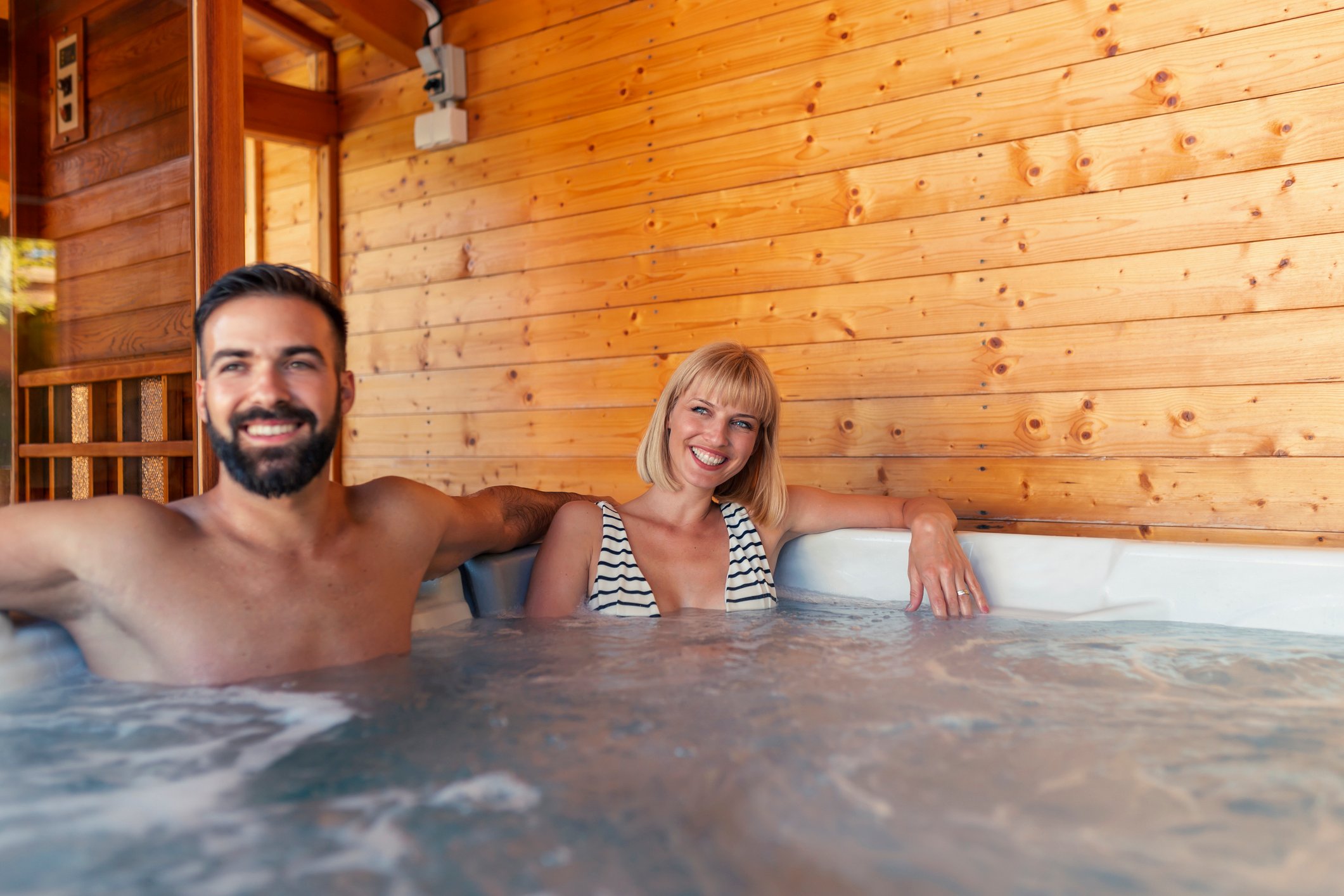 Couple relaxing in hot tub